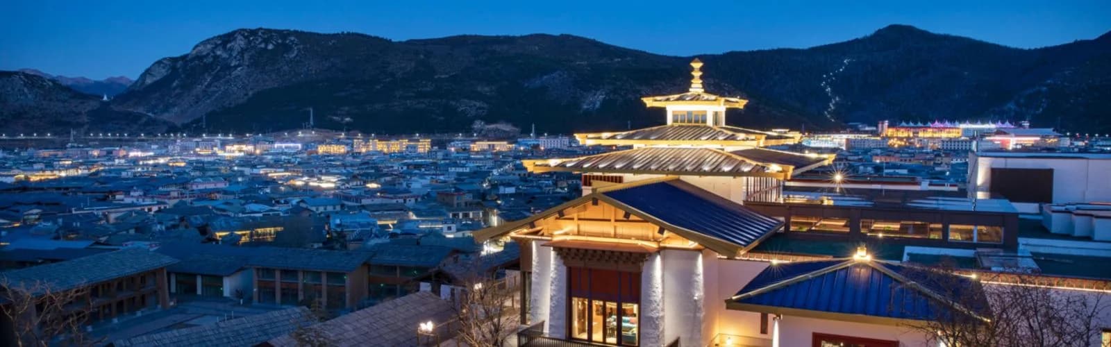 Hotel Indigo Diqing Moonlight City above Dukezong Old Town at night