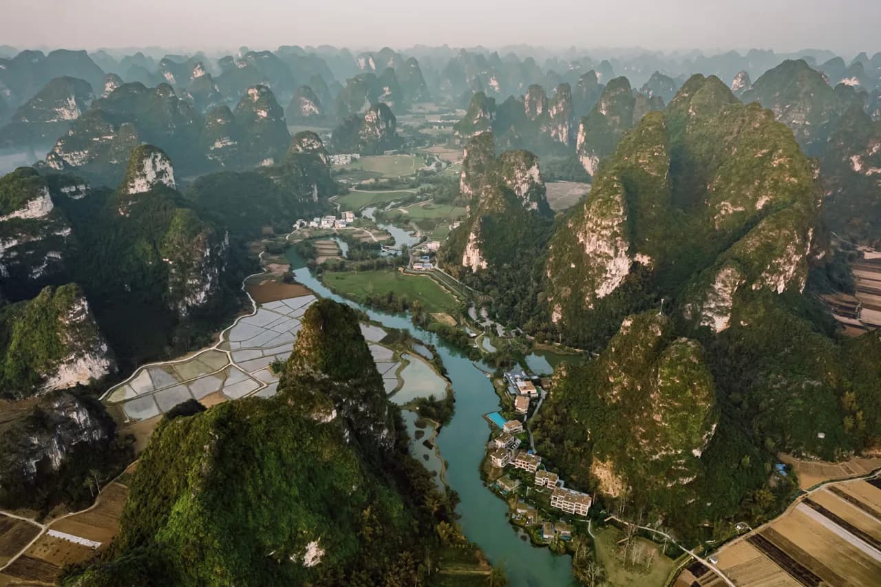 Aerial view of LUX* Chongzuo beside the Mingshi River and karst peaks