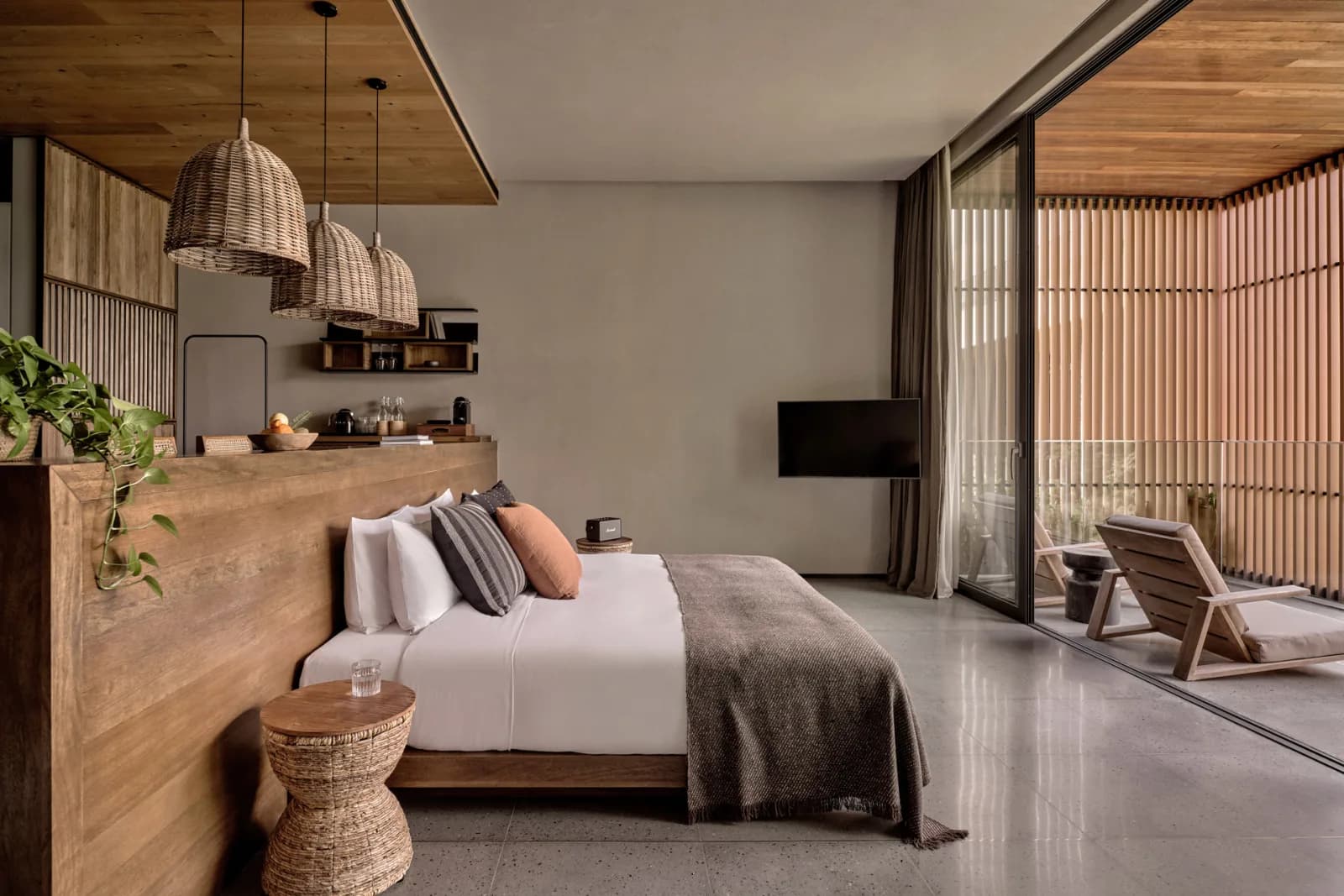 Natural-material suite interior at LUX* Chongzuo